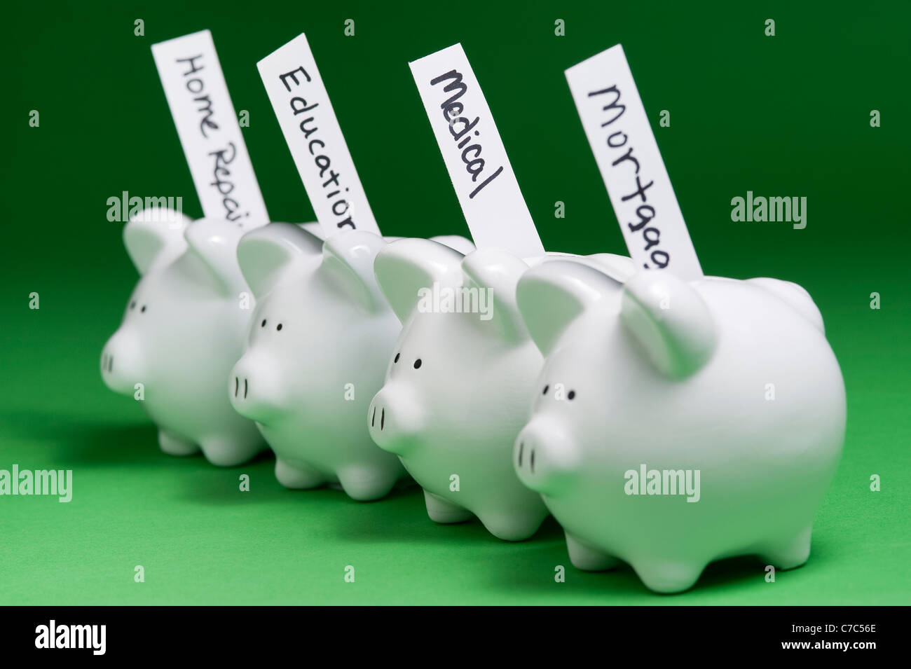 Piggy banks bills coming out hires stock photography and images Alamy