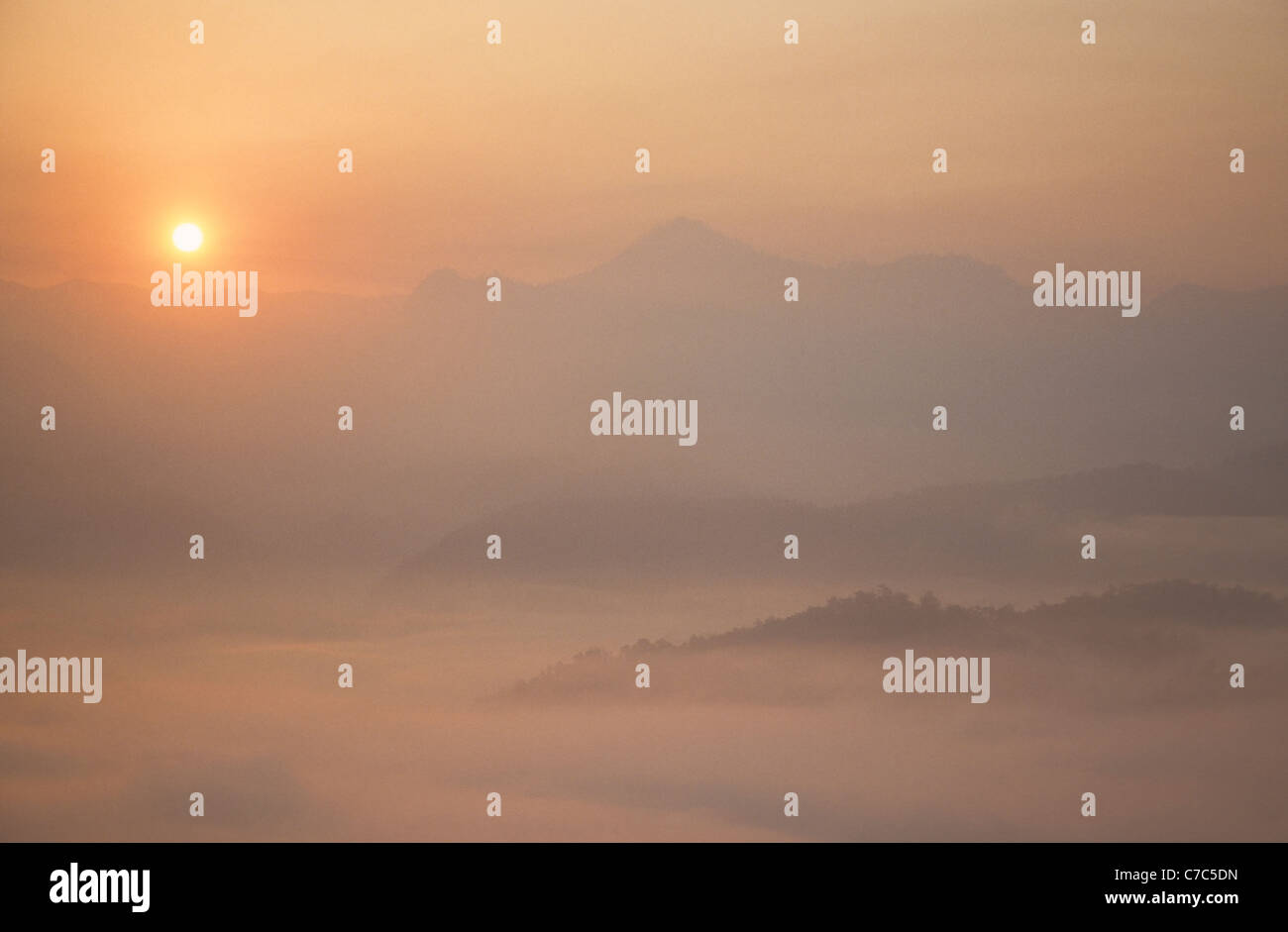Mae Hong Son (city of three mists) valley at sunrise, Thailand.  Taken from the Shan Hills. Image illustrating the morning mist. Stock Photo