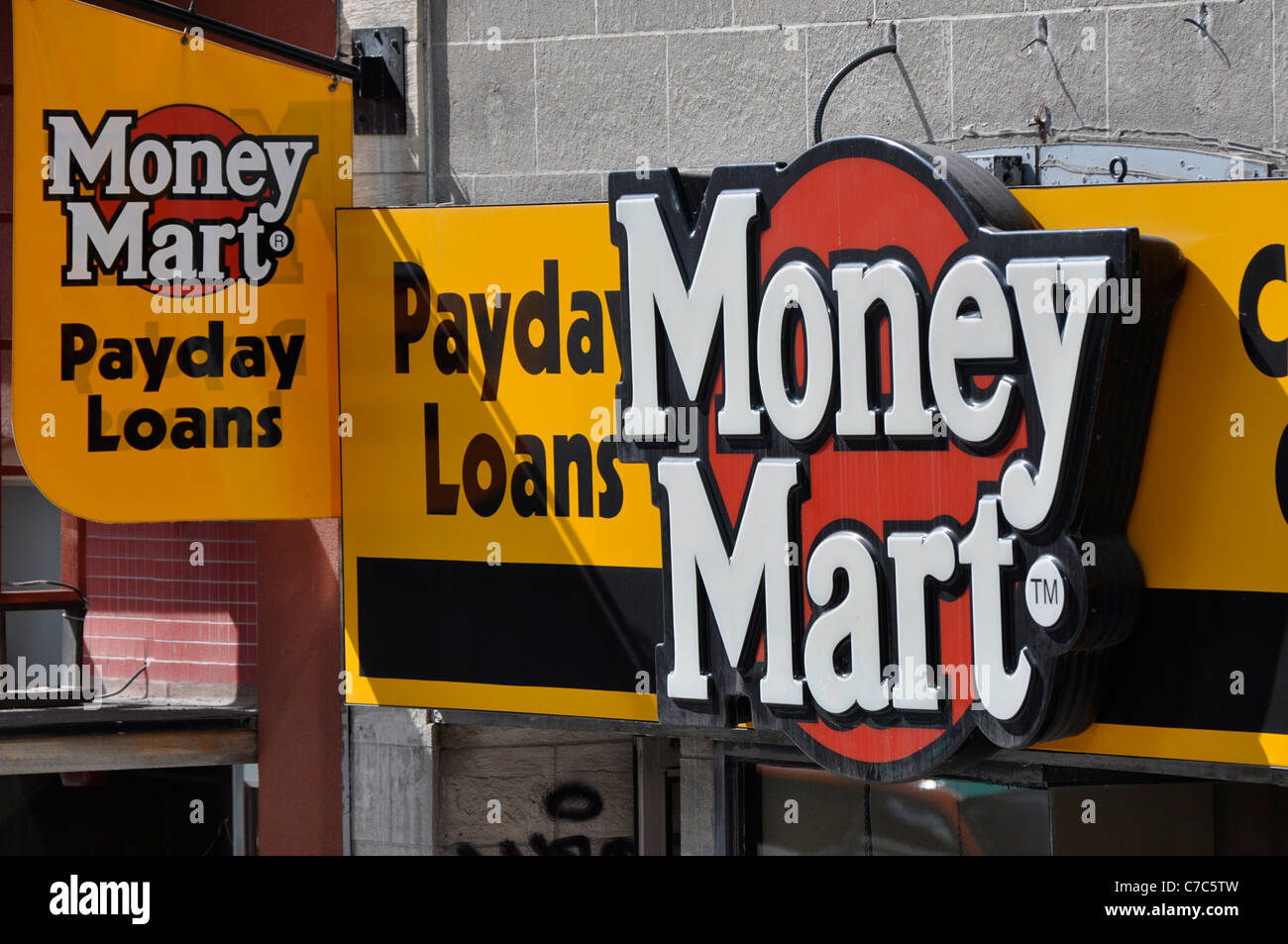 Payday Loans Sign on store front, Money Mart. Stock Photo