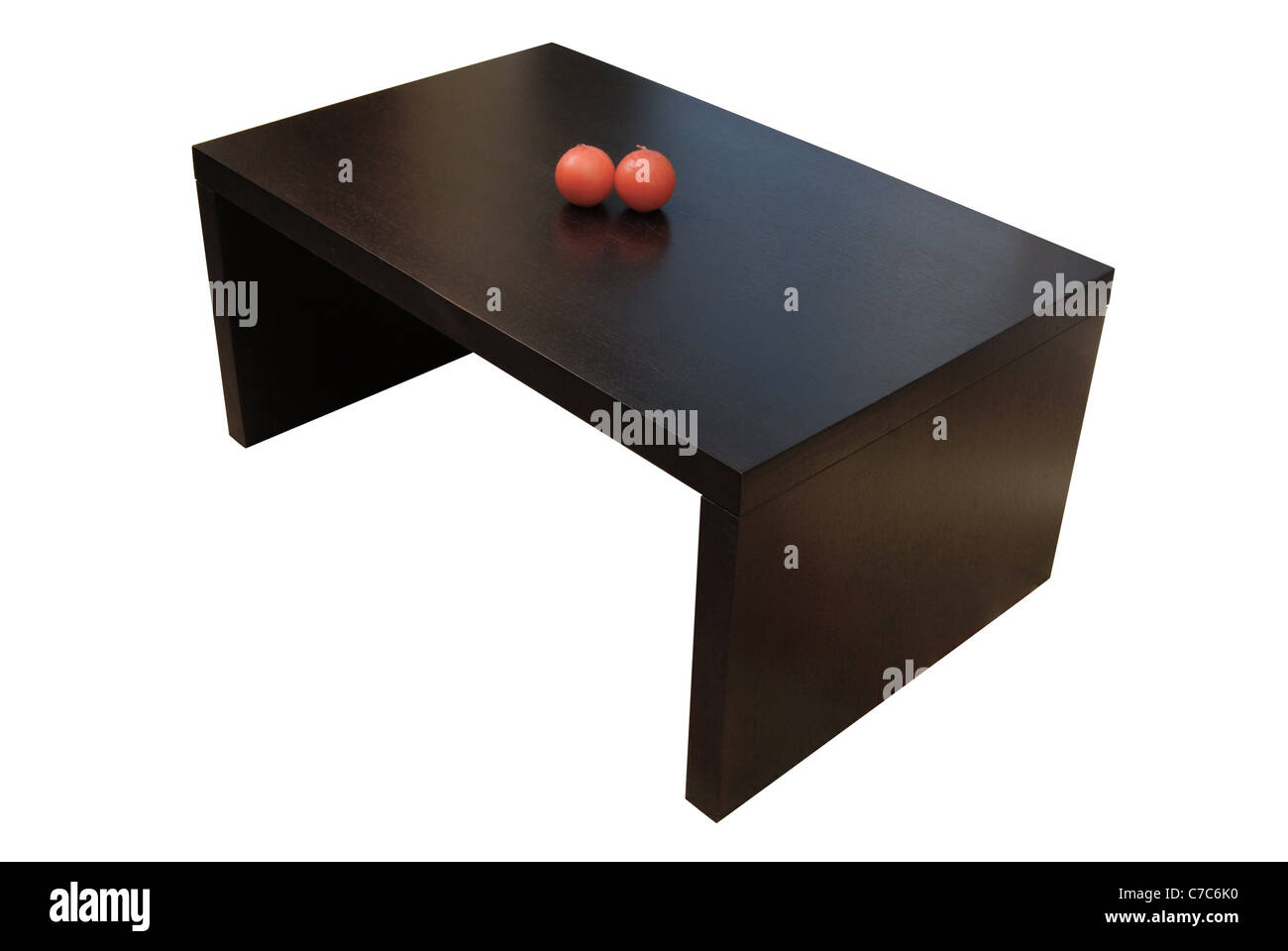 Contemporary brown wooden coffee table with candles isolated over white background with clipping path. Stock Photo