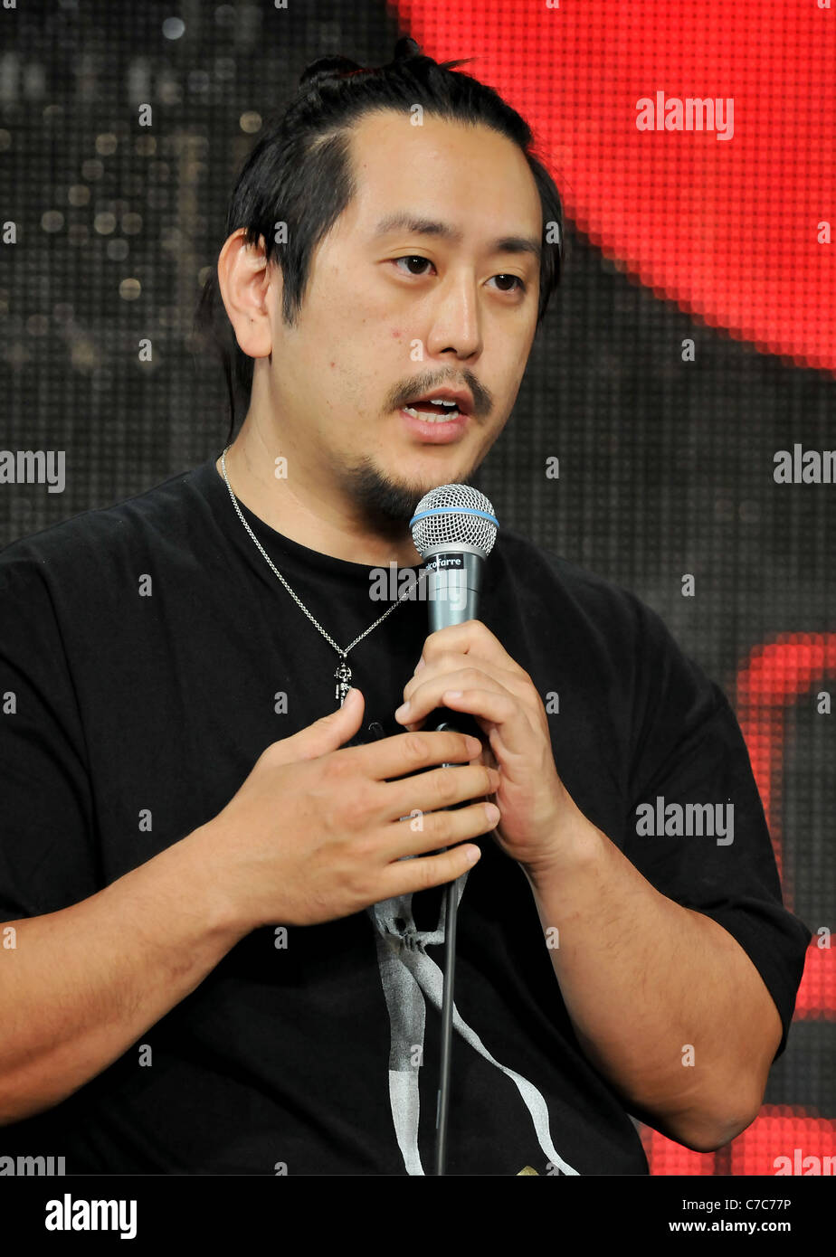 Joseph 'Joe' Hahn of American rock band 'Linkin Park' attends a press conference in Tokyo, Japan. Stock Photo