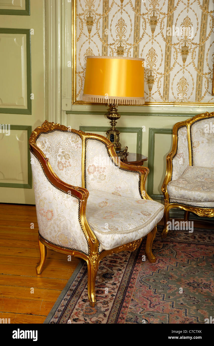 Elegant room with antique an armchair Stock Photo - Alamy