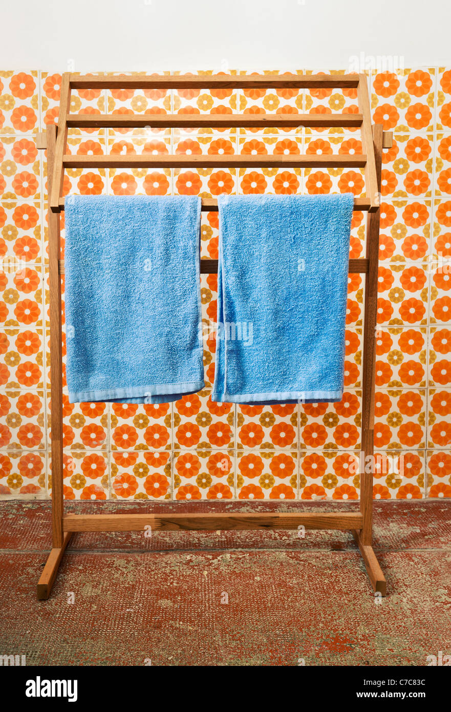 Blue towels on hanger in retro bathroom interior Stock Photo