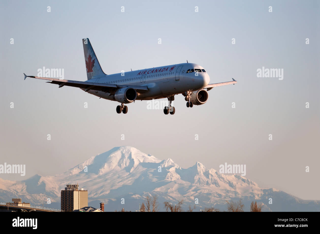 Air Canada airplane with Mt. Baker in the background Stock Photo