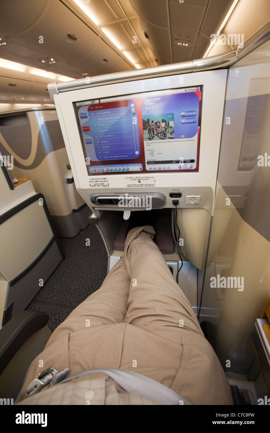 UK, Business Class Air Travel, upper deck of Emirates Airlines A380 aircraft, ICE digtal entertainment TV Stock Photo