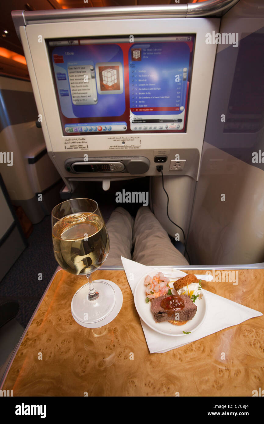 UK, Business Class Air Travel, glass of wine and hors d’oevres served on Emirates Airlines A380 aircraft Stock Photo