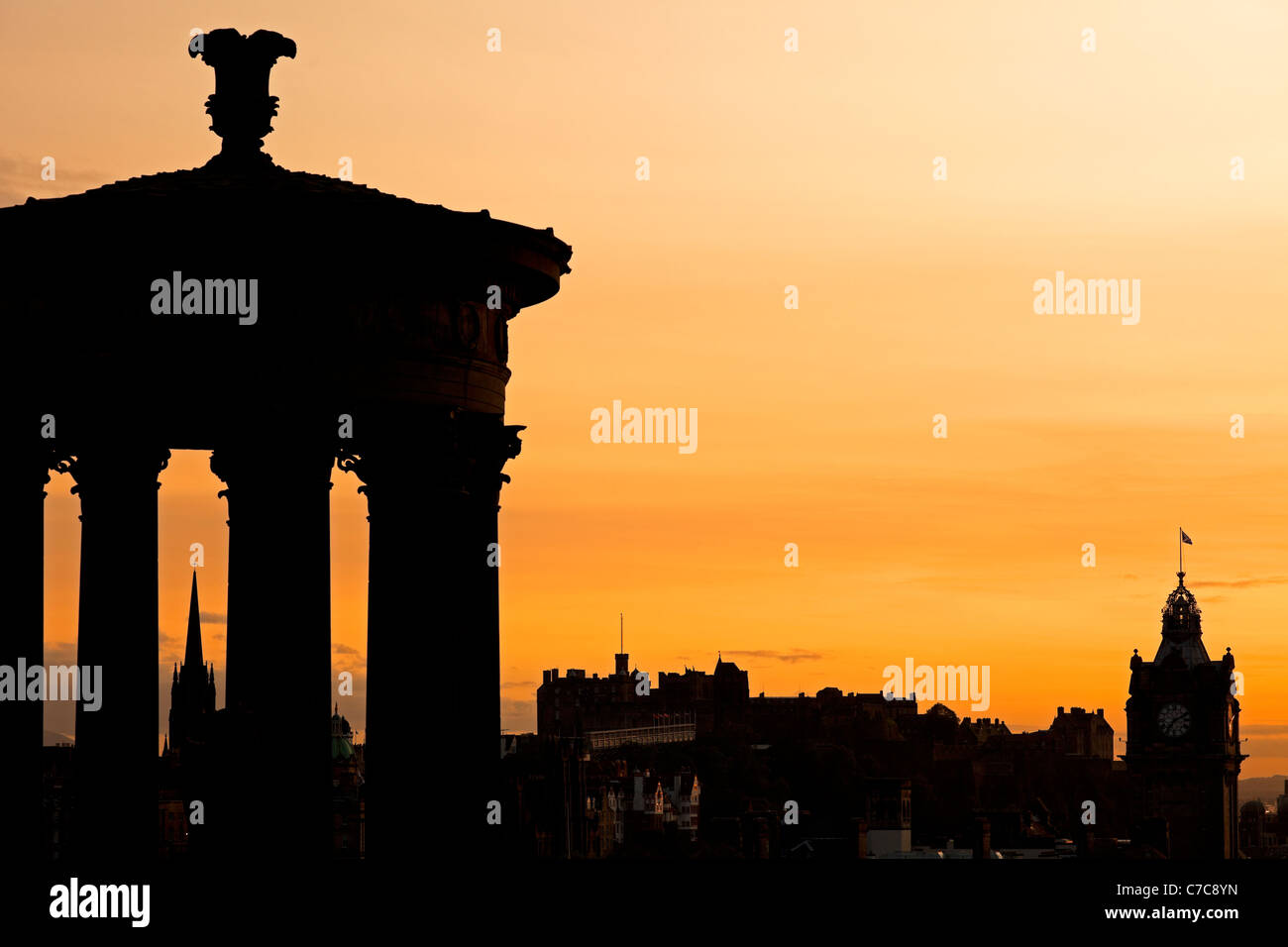 Sunset on Dugald Stewart monument and Edinburgh Castle, viewed from Calton Hill Scotland UK, Europe Stock Photo