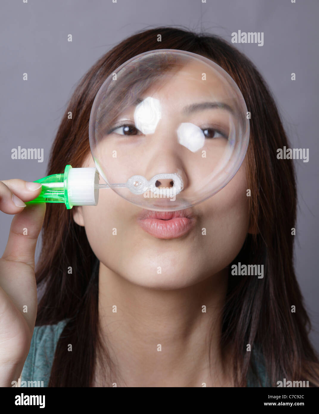 Girl blows soap bubbles Stock Photo Alamy