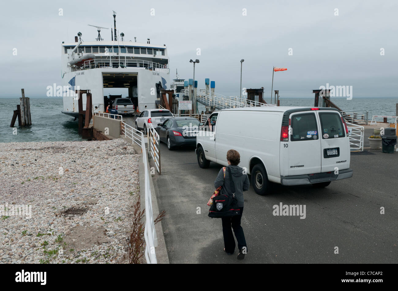 Cars, van & person boarding the car ferry 'Susan Anne' at Cross Sound Ferry terminal, Orient Point, Long Island, New York, USA Stock Photo
