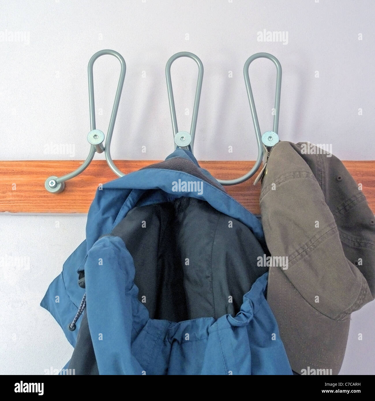 A Row of Coat Pegs with Coat Stock Photo Alamy