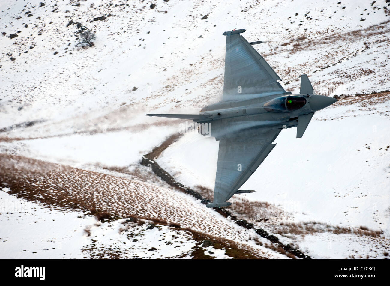Royal Air Force Eurofighter Typhoon aircraft on a low flying training flight over the hills of mid Wales, shot from the hills. Stock Photo