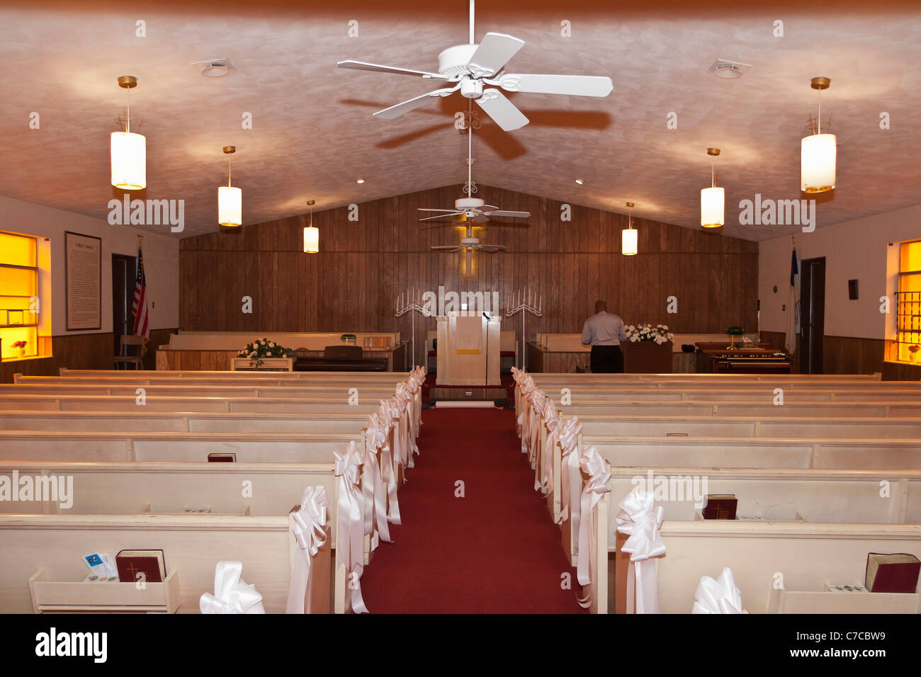 Inside a small Baptist church decorated for the wedding ceremony in USA Stock Photo