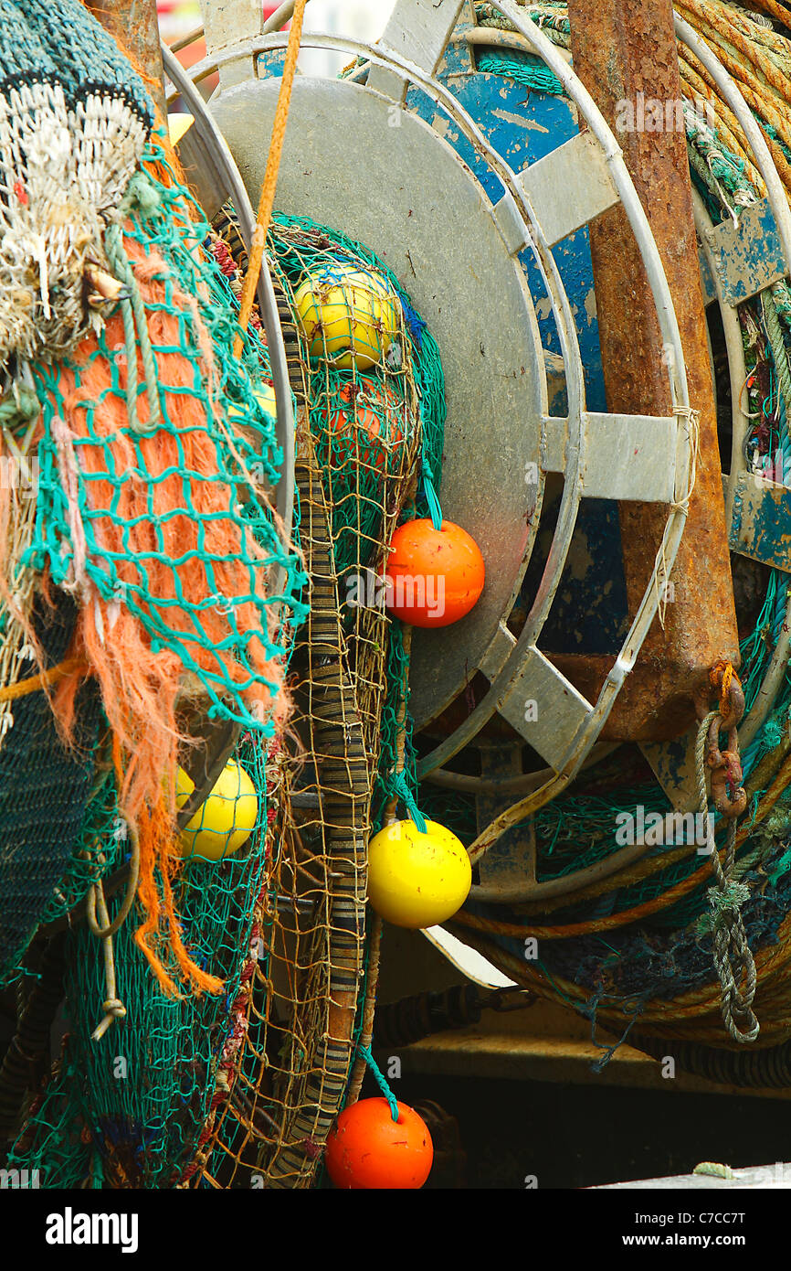 Reel of net on a trawler Stock Photo