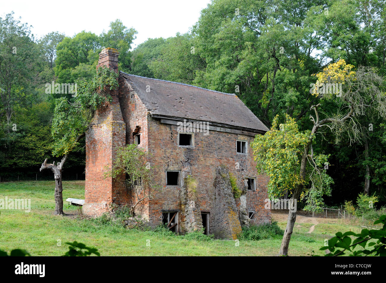 Derelict cottage in a Shropshire field England Uk Stock Photo