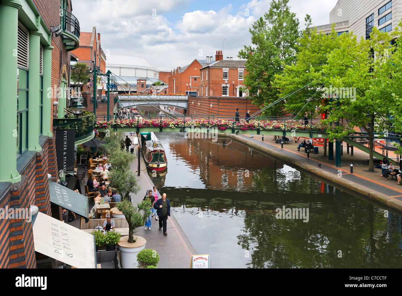 Narrowboats in front of restaurants on the canal at Brindley Place, Birmingham, West Midlands, England, UK Stock Photo
