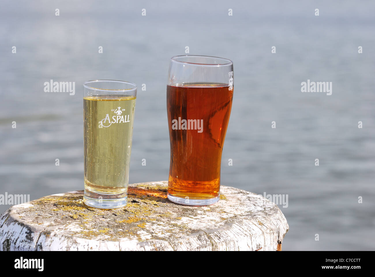 Glass of cider and Beer over river Stock Photo Alamy