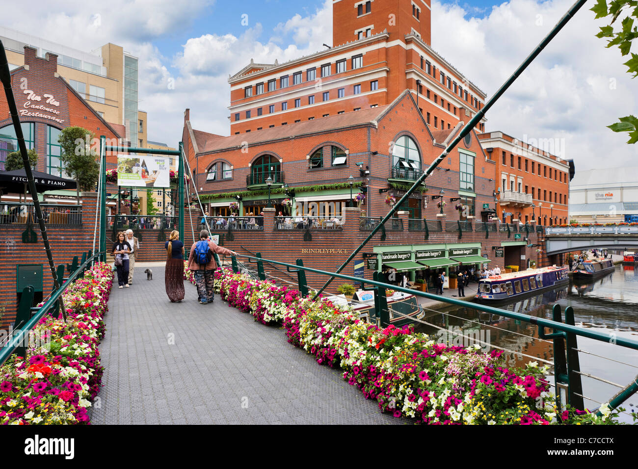 Bridge over the canal at Brindley Place with the NIA to the right, Birmingham, West Midlands, England, UK Stock Photo