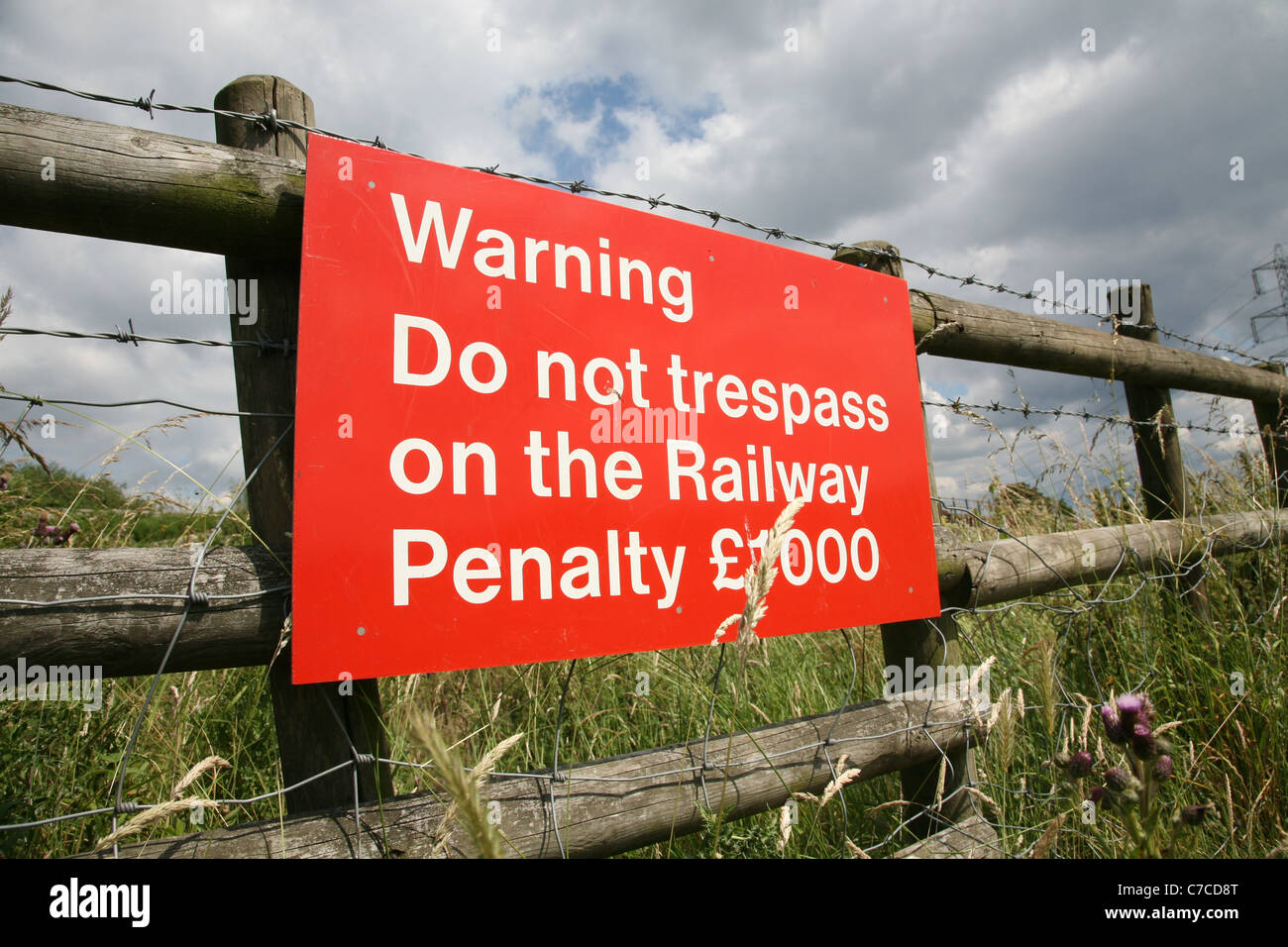 a sign warning people not to trespass on the railway Stock Photo