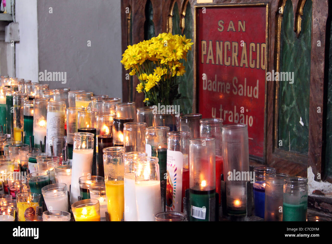 Devotional candles to Saint Pancras at a church in Panama City, Panama. Stock Photo
