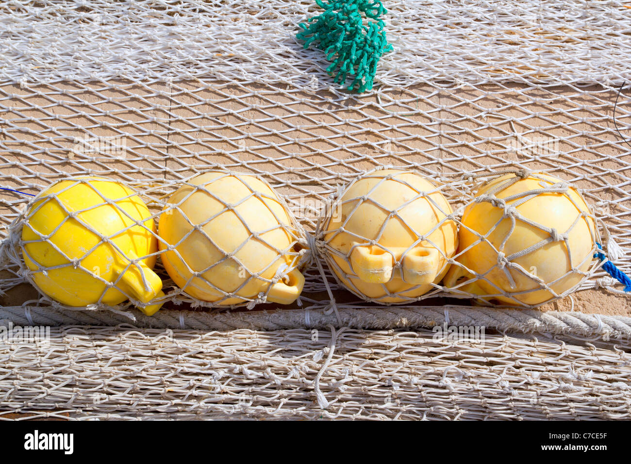 fishing tackle net detail with yellow four buoys Stock Photo - Alamy