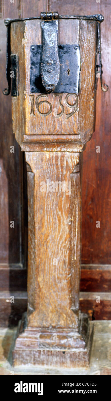 Mileham, Norfolk, Alms Box, Poor Box, 1639, with 3 three triple locks boxes English England UK church churches interior interior Stock Photo