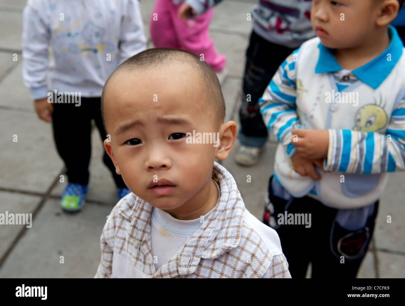 Children of migrant workers play at a kindergarten on outskirts of Beijing, China. 16-Sep-2011 Stock Photo