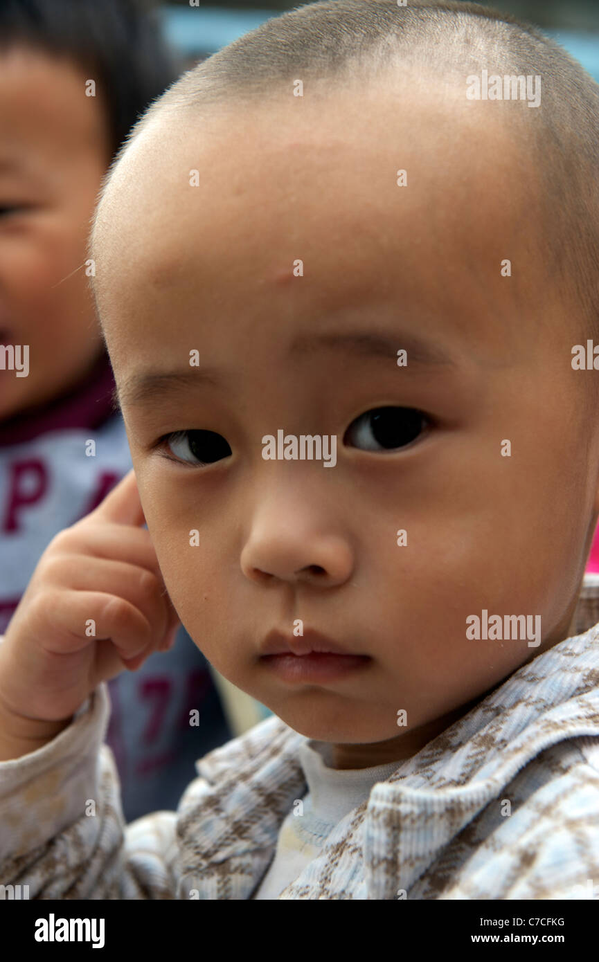A boy of migrant workers at a kindergarten on outskirts of Beijing, China. 16-Sep-2011 Stock Photo