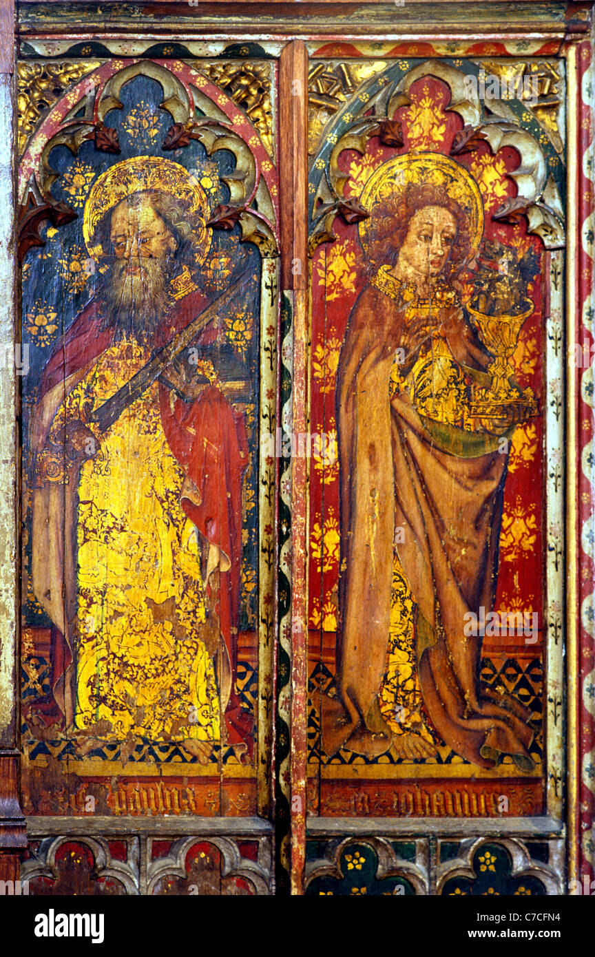 Old Hunstanton, Norfolk. Rood screen apostles, St. Paul with sword, St. John holding chalice with serpent issuing from within Stock Photo