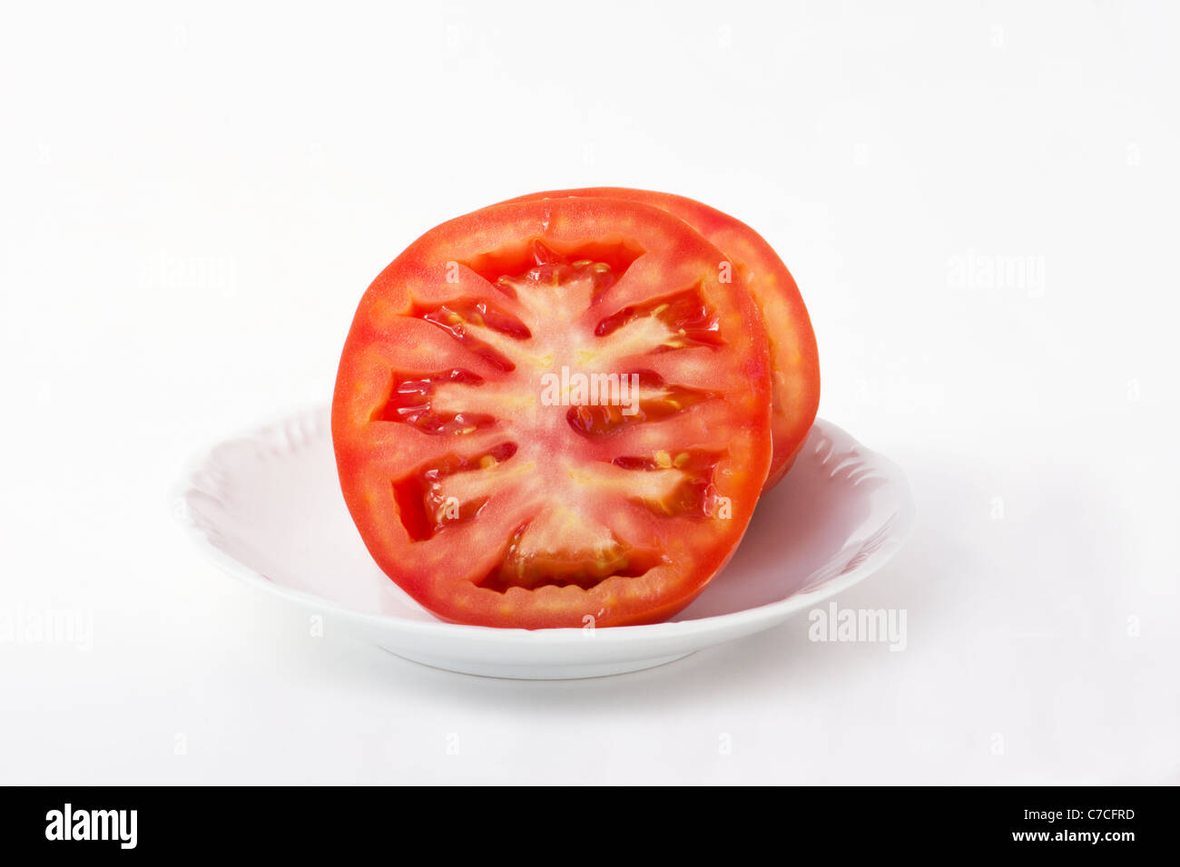 Closeup of Beefsteak tomato on white background Stock Photo Alamy