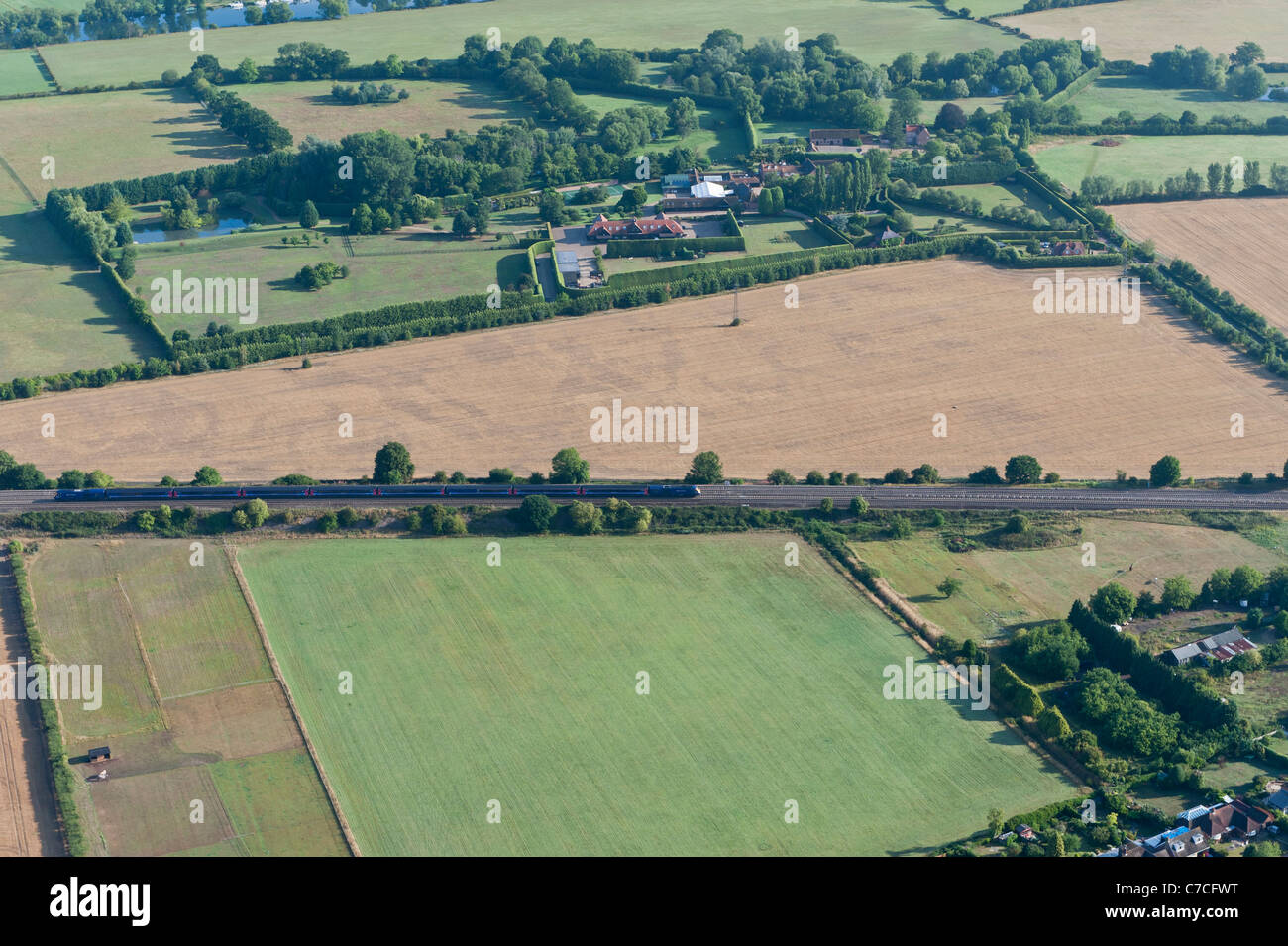 Aerial view of train in rural landscape, Berkshire, UK Stock Photo