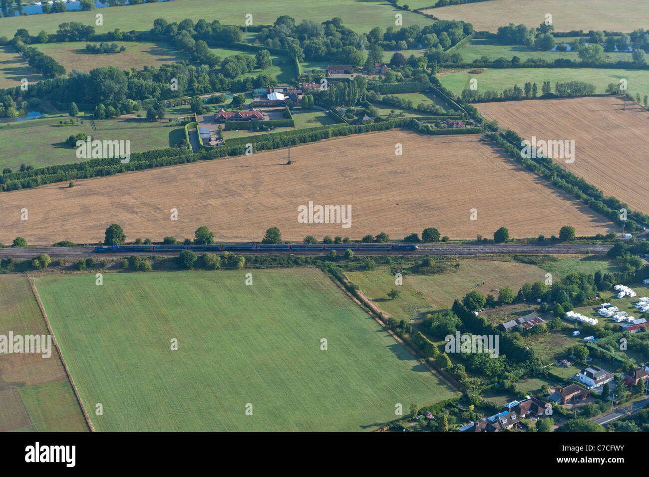 Aerial view of train in rural landscape, Berkshire, UK Stock Photo