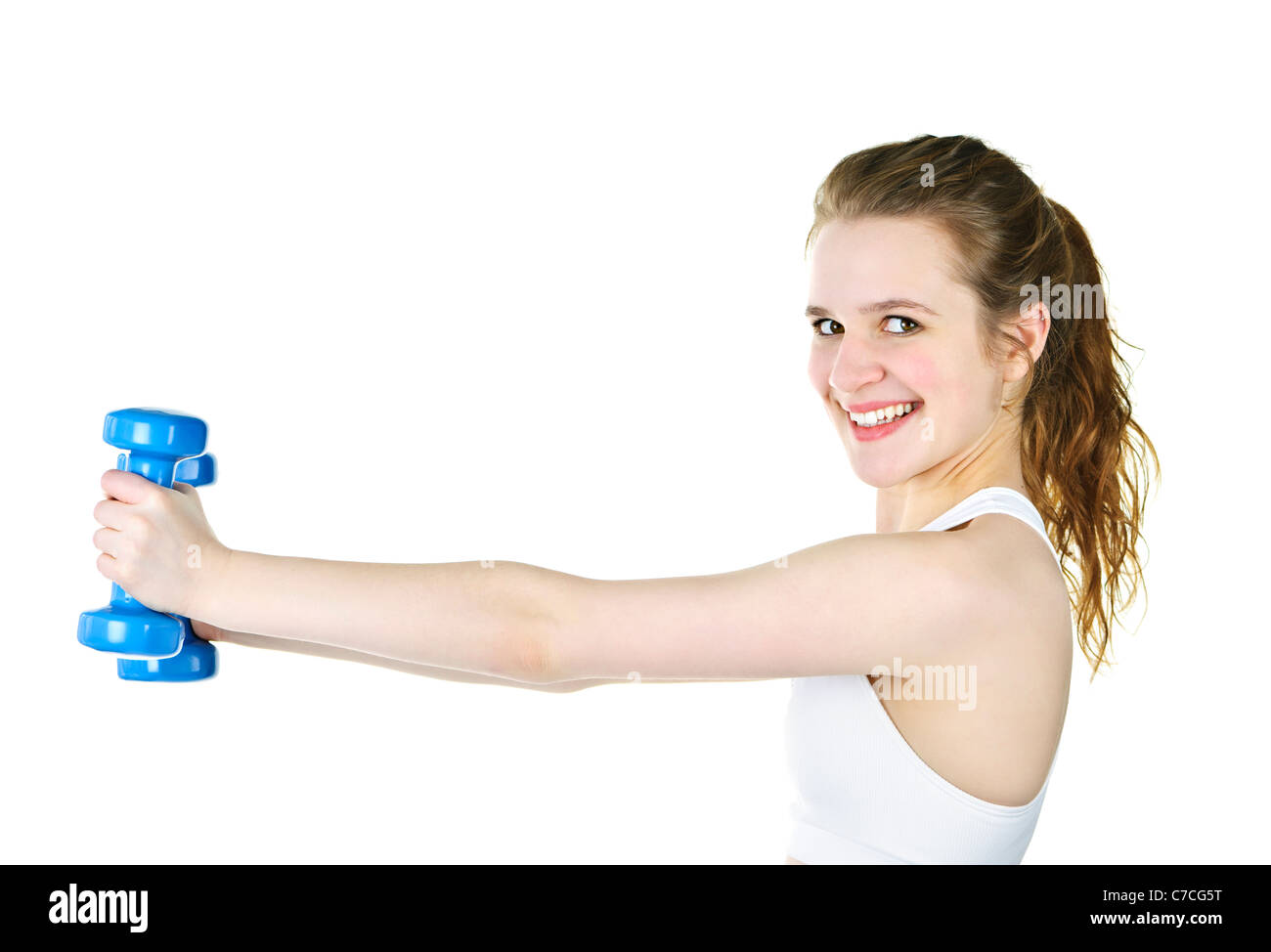 Happy healthy fit young woman lifting weights for fitness exercise Stock Photo
