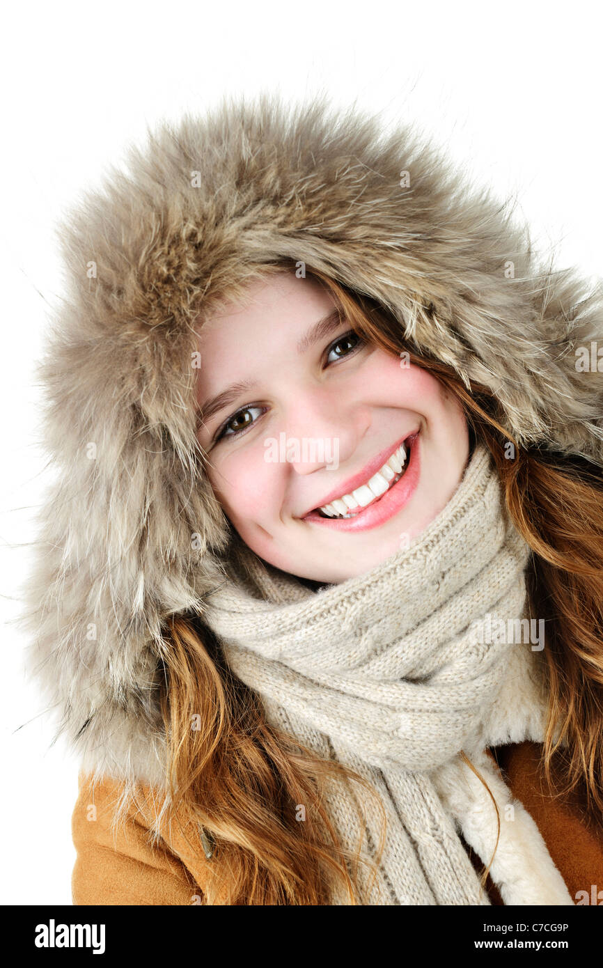 Beautiful young woman in fur hood of winter coat on white background ...