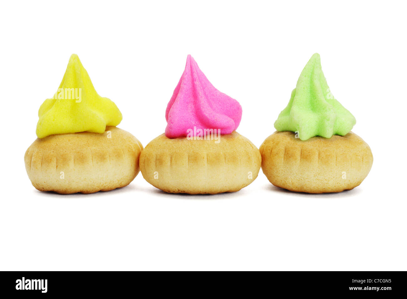 Three colorful icing topped cookies on white background Stock Photo