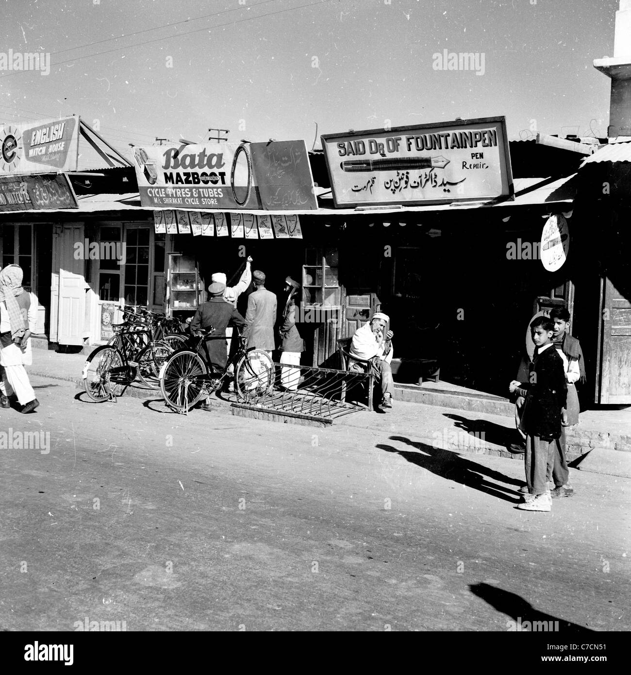 Exterior of bicycle repair shop, Shah Iqbal Street, Quetta, Pakistan, taken in the 1950s by J. Allan Cash. Stock Photo