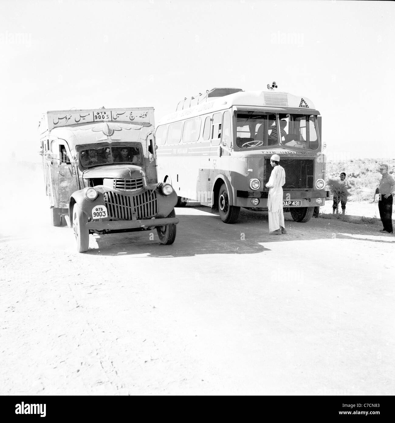 Two trucks at Dhadar, near the Bolan Pass, Pakistan, taken in the 1950s by J. Allan Cash. Stock Photo