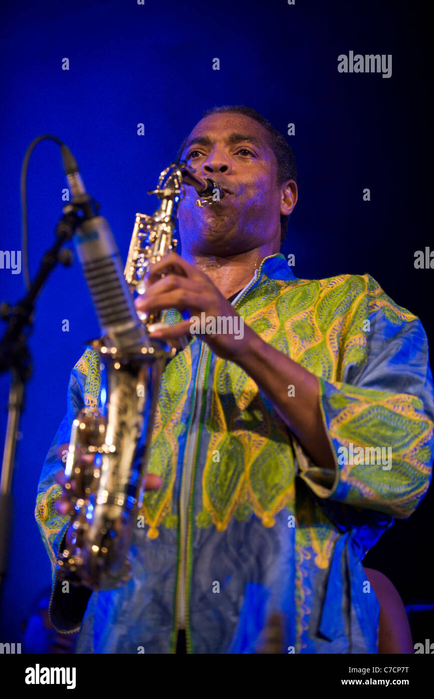 African Nigerian musician FEMI KUTI playing saxophone with his band at