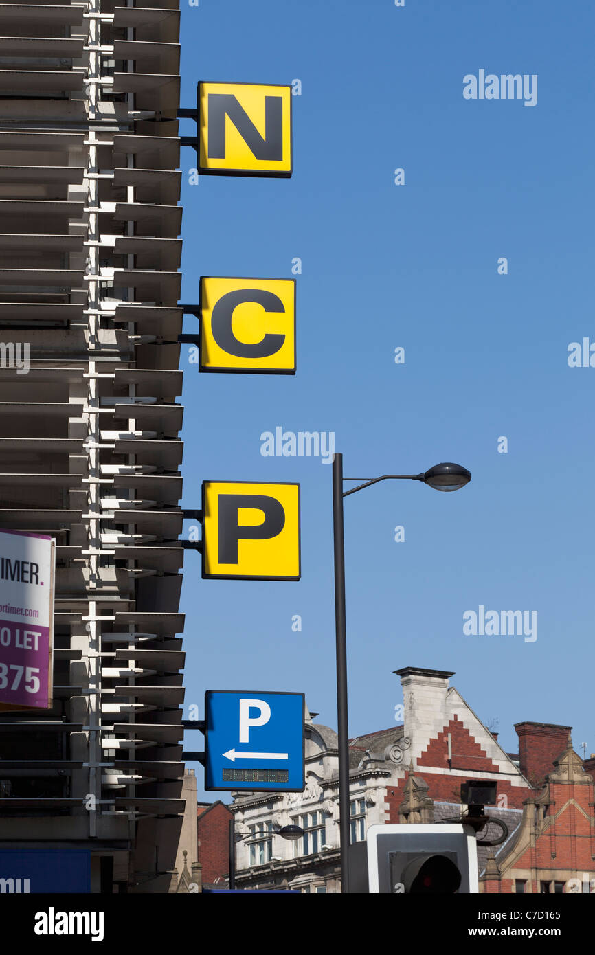 NCP Car Parking Sign on the side of a multi-storey car park, England. Stock Photo