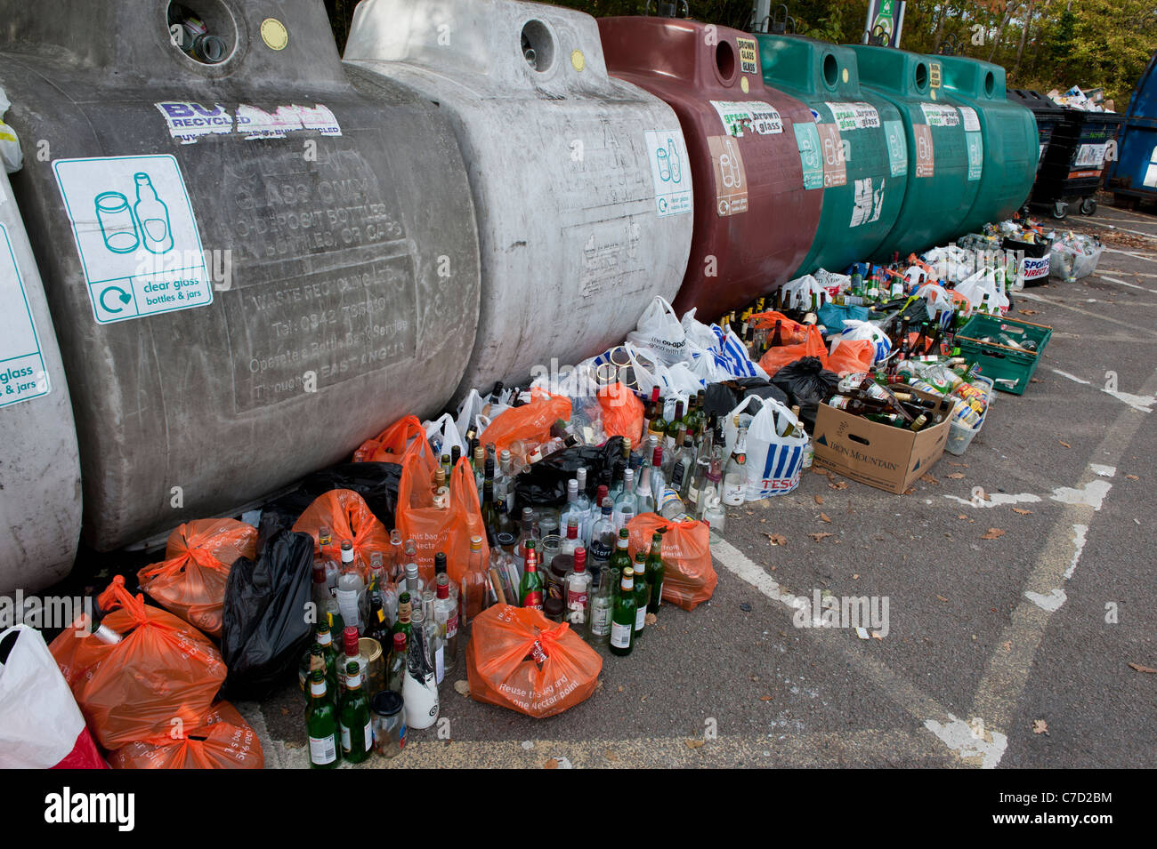 Recycling of bottles and glass jars at a Sainsburys supermarket bottle