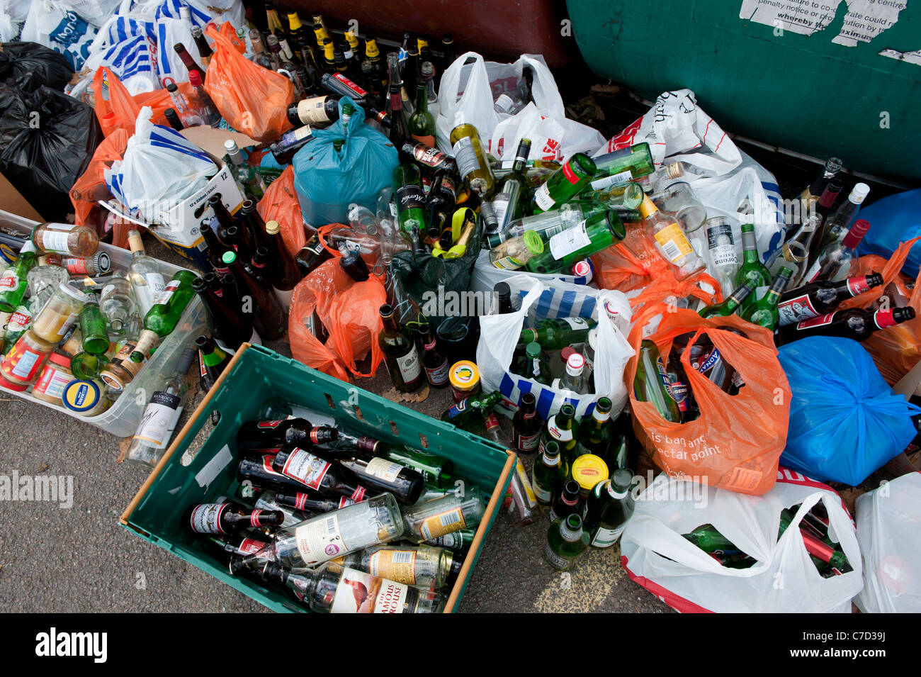 Recycling of bottles and glass jars at a Sainsburys supermarket bottle