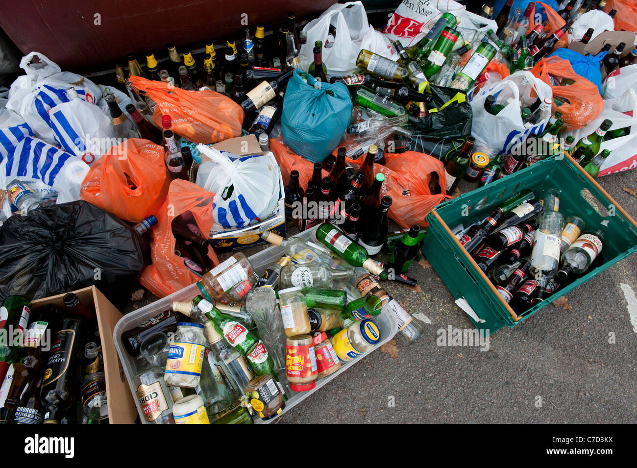 Recycling of bottles and glass jars at a Sainsburys supermarket bottle