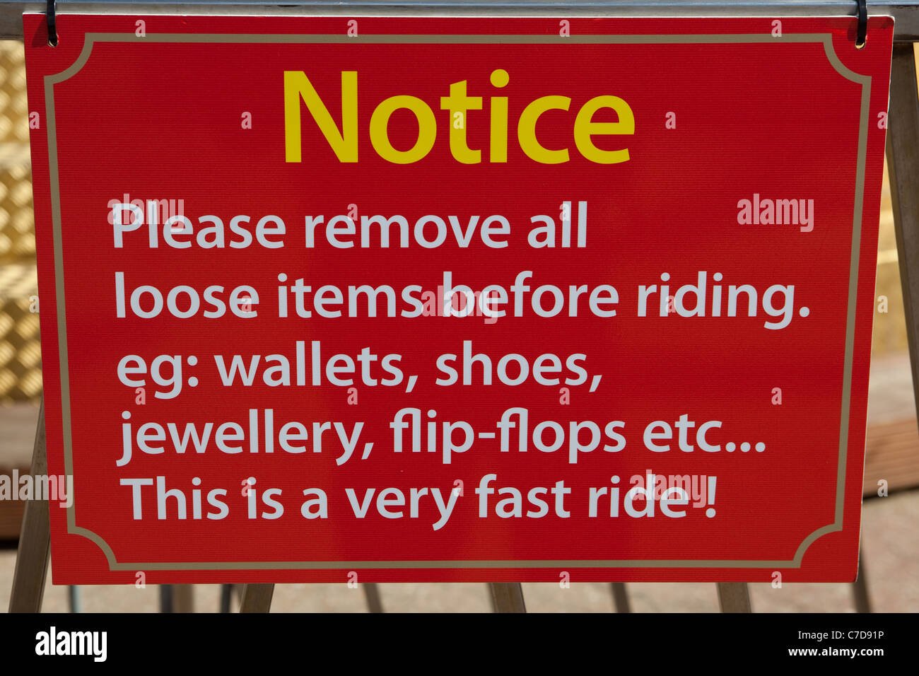 Warning sign for fairground ride Bournemouth beach England UK Stock Photo