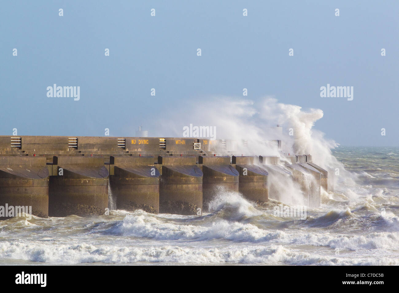 Storm waves crash over sea wall at Brighton Marina, Brighton, East Sussex, UK, autumn Stock Photo