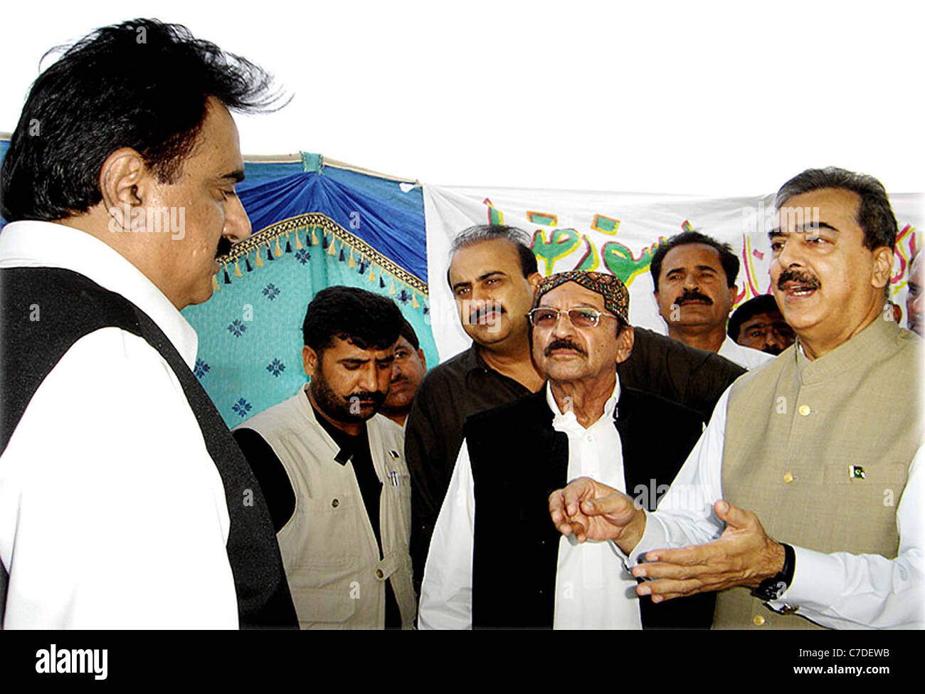 Syed Yousuf Raza Gilani talking to District Management Officials regarding arrangements for flood affected people Stock Photo