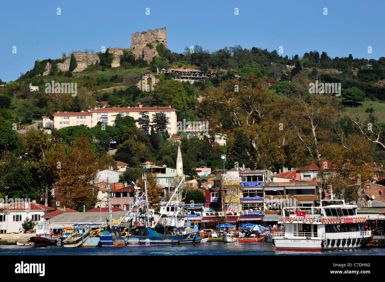 Genovese castle stands above the small fishing and tourist village of Anadolu Kavagi near the Black Sea. The Bosporus Strait. Stock Photo