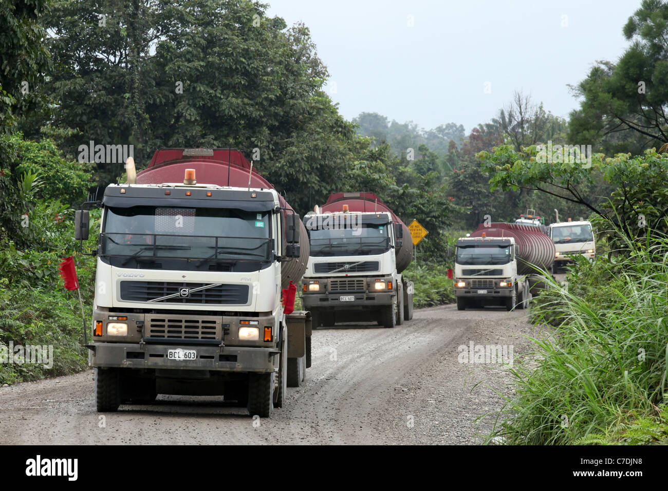 Convoy of fuel trucks brings diesel from Kiunga port to the Ok Tedi copper mine near Tabubil. Western Province, Papua New Guinea Stock Photo