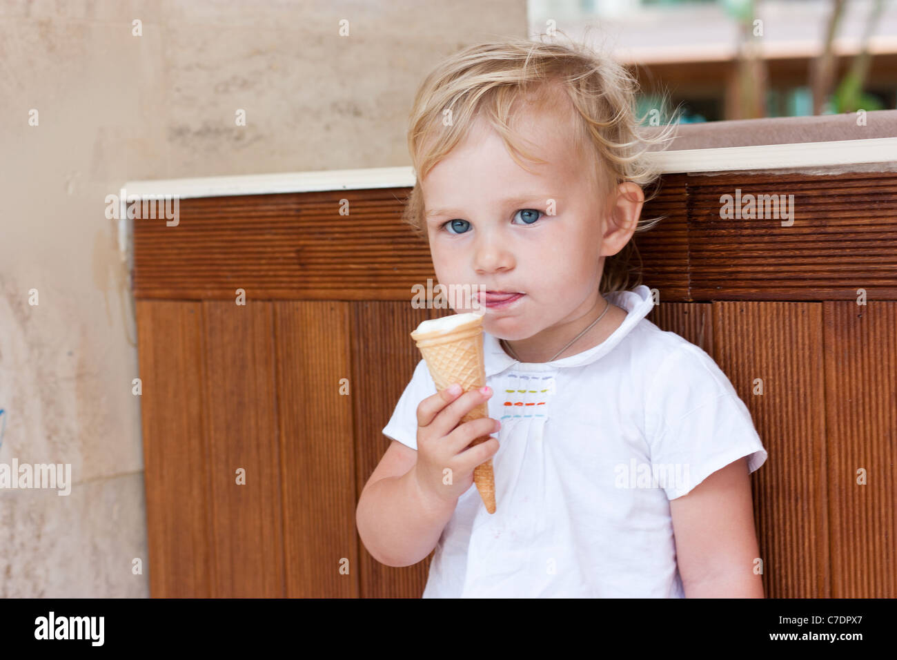 Cute little kid eating icecream outdoor Stock Photo Alamy