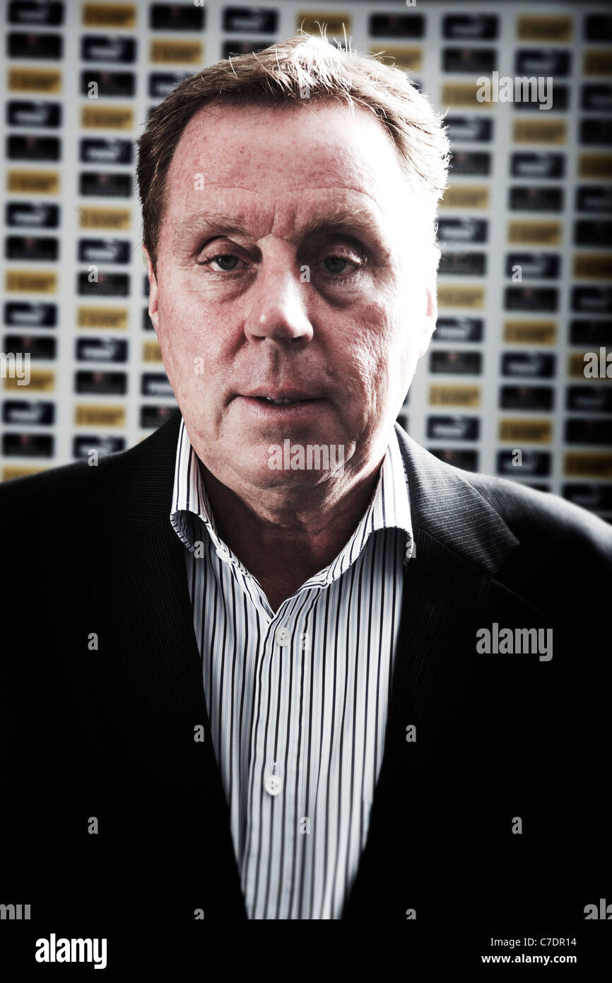 Head and shoulders straight on portrait of Harry Redknapp in training room premier league manager pundit Stock Photo