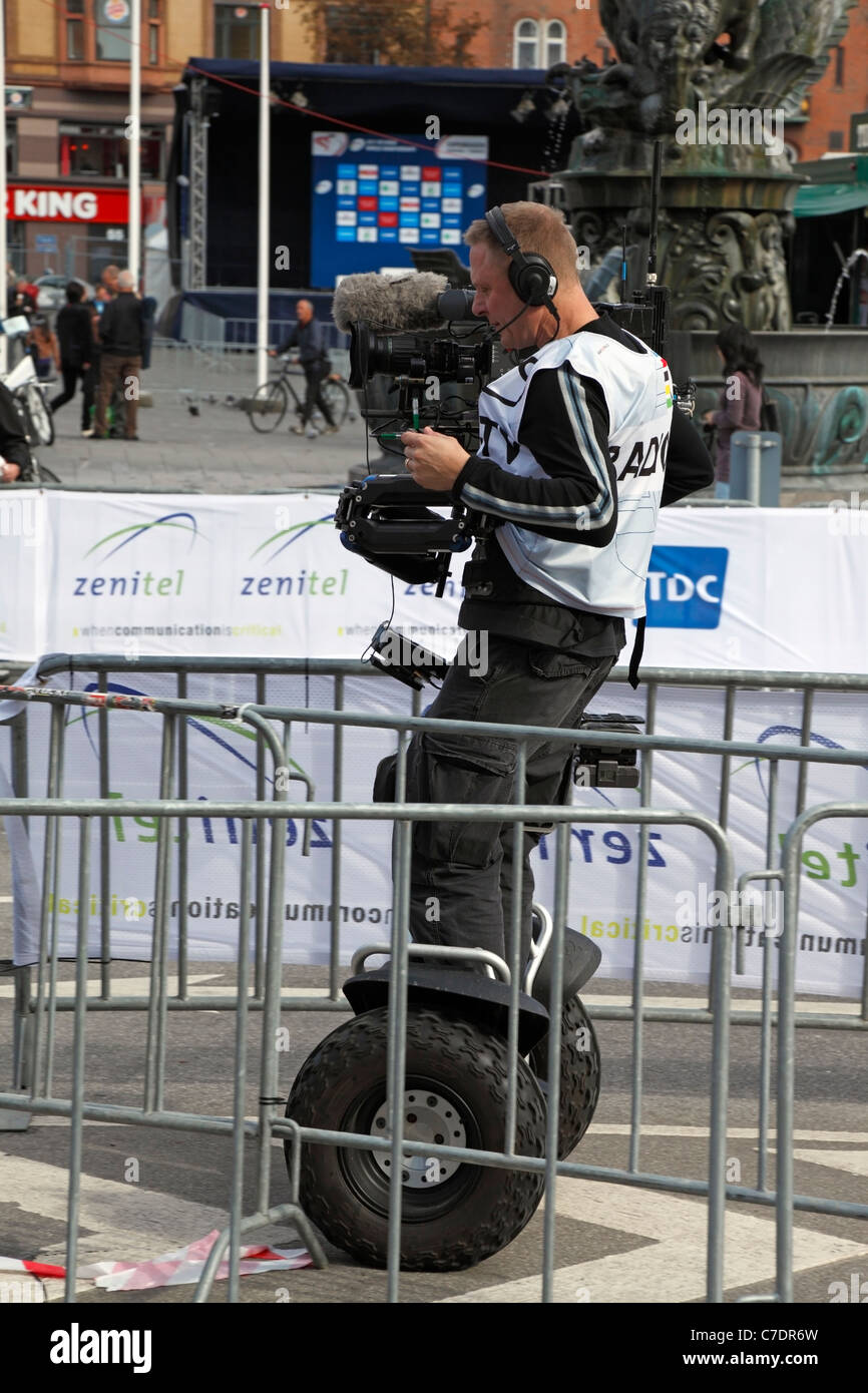 Camera man on a segway with steadycam at the 2011 UCI (International Cycling Union) Road World Championships in Copenhagen Stock Photo