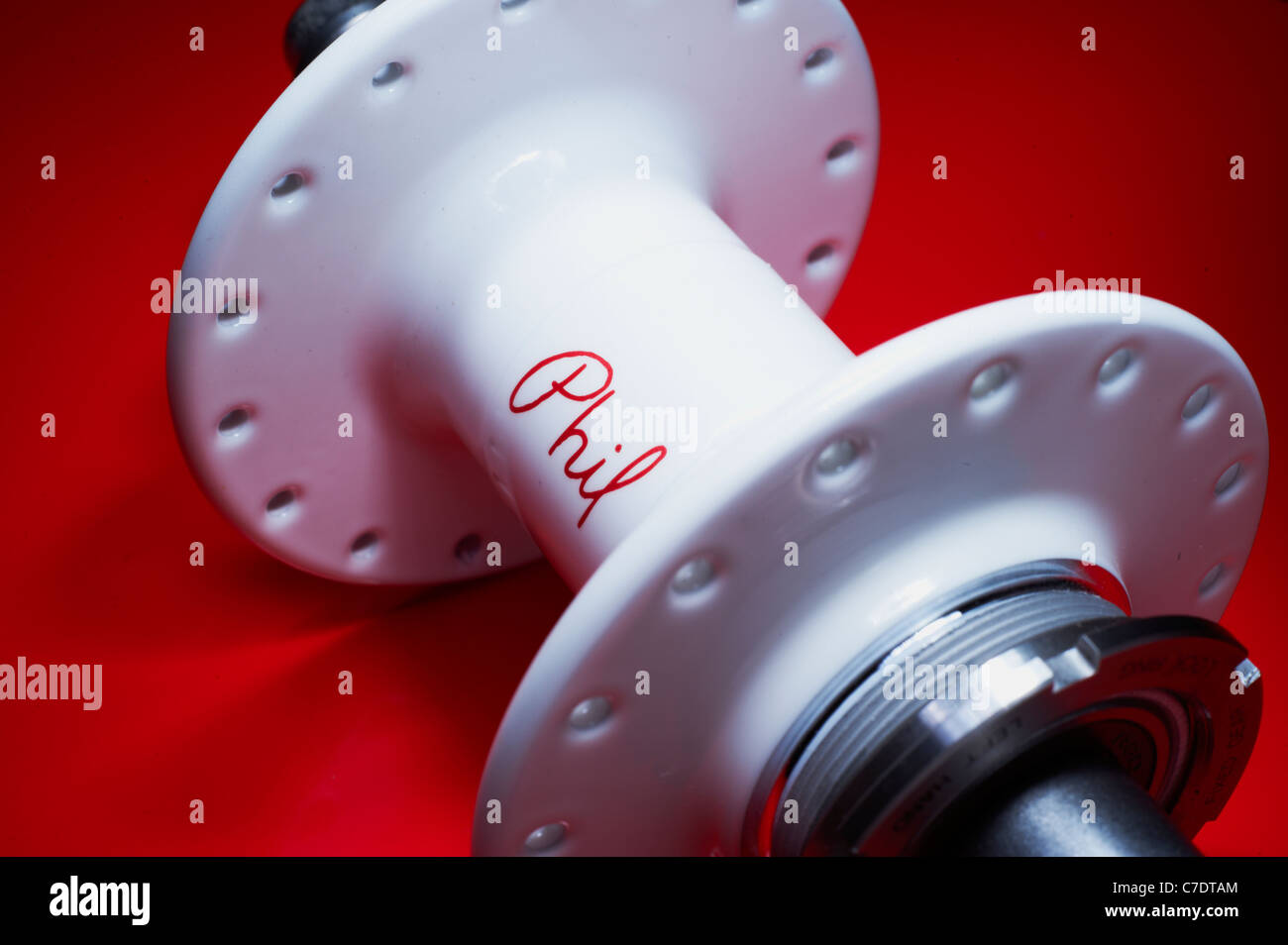 Phil Wood Rear High Flange Track Hub on red Stock Photo
